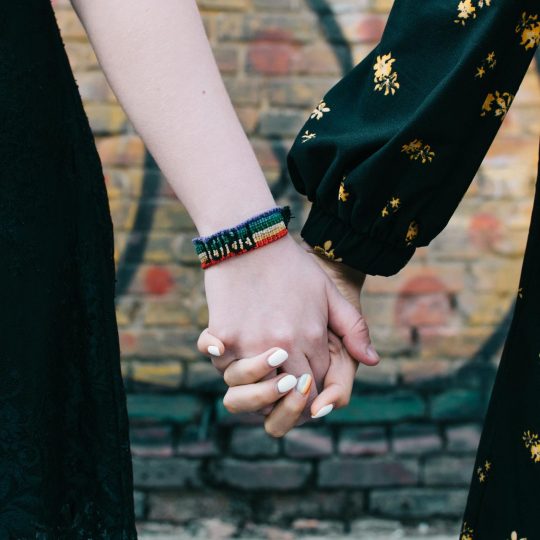 loseup-of-two-female-lgbt-gay-couple-holding-hands-SUH5M4E.jpg