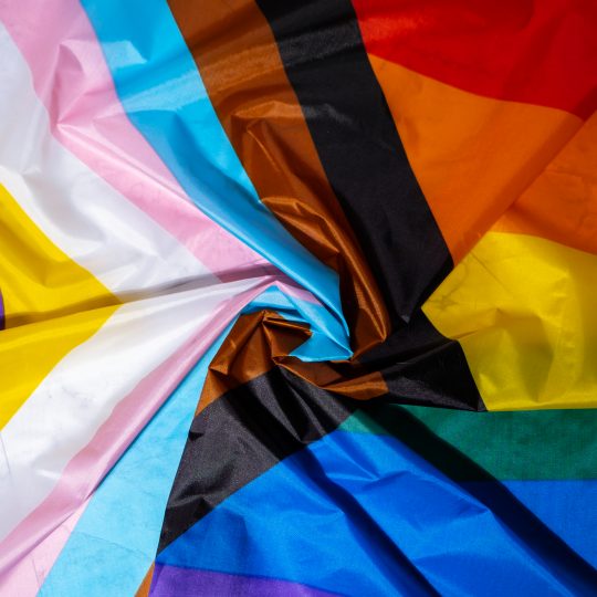 Rainbow LGBTQIA flag made from silk material. Happy pride month. Symbol of LGBTQ pride month. Equal